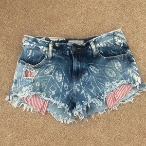 Free People distressed patterned denim shorts 26